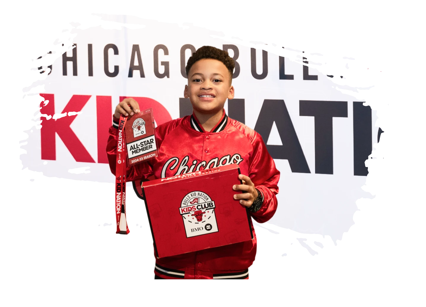 Kid holding up a kid nation kit